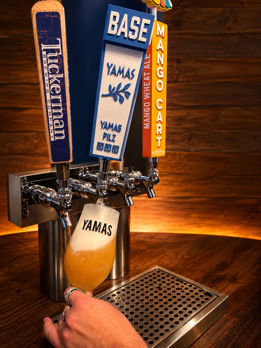 Yamas draft beer taps mid-pour