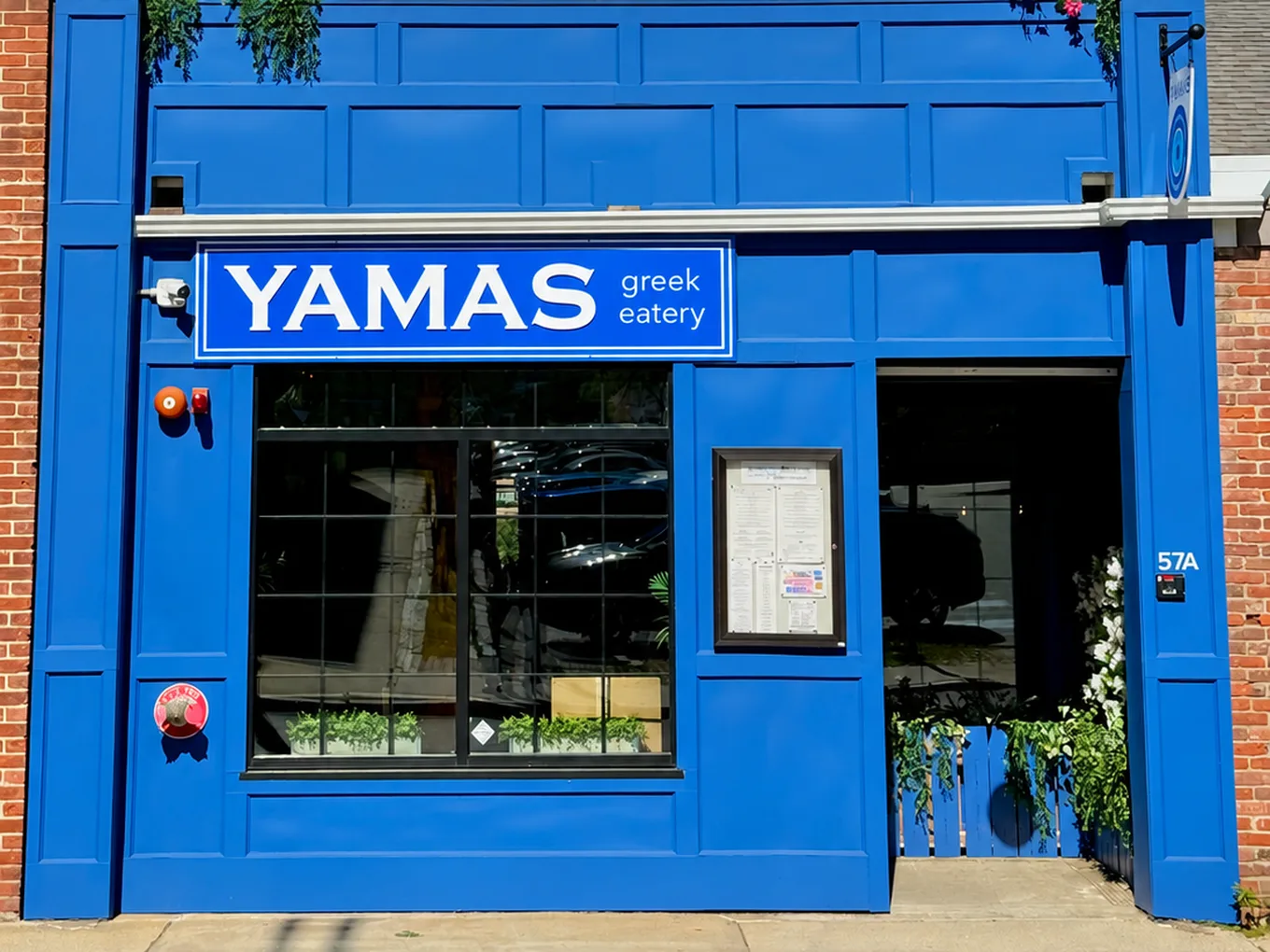The blue Yamas Greek Eatery storefront in Nashua, New Hampshire